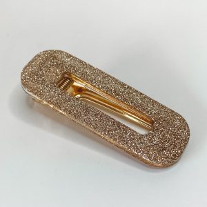 Barrette résine pailletée champagne.