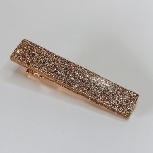 Barrette résine pailletée champagne.