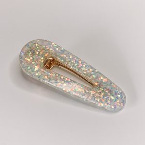 Barrette résine pailletée blanc nacré.