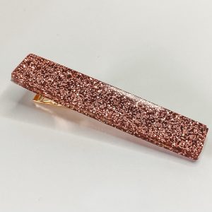Barrette résine pailletée rose gold.